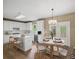 Well-lit kitchen with stainless steel appliances, island, and eat-in dining area at 740 Orchard Ct, Atlanta, GA 30328