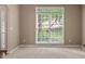 Neutral living room with large window that provides natural light at 740 Orchard Ct, Atlanta, GA 30328