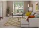 Cozy living room with a plush sectional sofa and a work from home desk space at 740 Orchard Ct, Atlanta, GA 30328