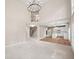 Open-concept living room with views of the staircase and updated kitchen at 740 Orchard Ct, Atlanta, GA 30328