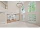 Open living room with view of kitchen featuring an island and white cabinets at 740 Orchard Ct, Atlanta, GA 30328