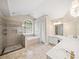 Luxurious bathroom featuring a walk-in shower, jacuzzi tub, and dual sink vanity at 740 Orchard Ct, Atlanta, GA 30328