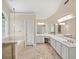 Primary bathroom with a walk-in shower, jacuzzi tub, and long vanity with two sinks at 740 Orchard Ct, Atlanta, GA 30328