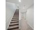 Stairway with carpeted steps and white banister at 740 Orchard Ct, Atlanta, GA 30328