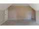 Attic bedroom featuring a door and an entrance into another room at 1615 Burnt Oak Way, Dacula, GA 30019
