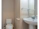 Clean bathroom with pedestal sink and toilet at 1615 Burnt Oak Way, Dacula, GA 30019