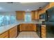A functional kitchen with generous counter space, wood cabinets and modern appliances at 1615 Burnt Oak Way, Dacula, GA 30019