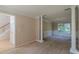 Spacious living room with decorative columns, wainscotting, and large windows at 1615 Burnt Oak Way, Dacula, GA 30019