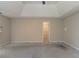 Large primary bedroom with a tray ceiling and a walk-in closet at 1615 Burnt Oak Way, Dacula, GA 30019