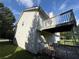 Angled backyard view of the home with a two-tiered deck at 380 Paper Mill Rd, Lawrenceville, GA 30046