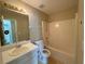 Bathroom featuring a vanity, toilet, and shower-tub combination at 380 Paper Mill Rd, Lawrenceville, GA 30046