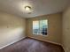 Bedroom with carpet flooring and a window for natural light at 380 Paper Mill Rd, Lawrenceville, GA 30046