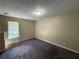 Bedroom with carpet flooring and a window for natural light at 380 Paper Mill Rd, Lawrenceville, GA 30046