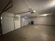 Garage featuring multiple bays and an automatic door opener at 380 Paper Mill Rd, Lawrenceville, GA 30046