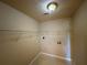 Laundry room with shelving, tile floor, and washer/dryer hookups at 380 Paper Mill Rd, Lawrenceville, GA 30046