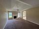 Living room features a fireplace and ceiling fan, windows offer natural light at 380 Paper Mill Rd, Lawrenceville, GA 30046