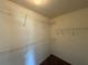 Walk-in closet with ample shelving to maximize storage space at 380 Paper Mill Rd, Lawrenceville, GA 30046