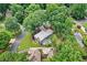 Aerial shot showcases a home nestled among lush trees in a quiet neighborhood at 4619 Villa Chase Ne Dr, Marietta, GA 30068