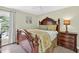 Bedroom with dark wood furnishings, a light green wall color and natural light from the window at 4619 Villa Chase Ne Dr, Marietta, GA 30068