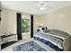 Bright bedroom with a twin bed, plush rug, and a view of the landscaped yard at 4619 Villa Chase Ne Dr, Marietta, GA 30068