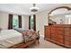 Comfortable bedroom featuring a plush bed, stylish dresser, and neutral décor at 4619 Villa Chase Ne Dr, Marietta, GA 30068