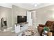 Relaxing bonus room featuring a large TV, comfortable seating, and contemporary decor at 4619 Villa Chase Ne Dr, Marietta, GA 30068