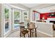 Bright breakfast nook with a charming table setting and scenic views from large windows at 4619 Villa Chase Ne Dr, Marietta, GA 30068