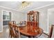 Elegant dining room featuring a crystal chandelier and traditional wooden furniture at 4619 Villa Chase Ne Dr, Marietta, GA 30068