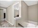 Hallway view leading from the staircase and featuring neutral paint and modern flooring at 4619 Villa Chase Ne Dr, Marietta, GA 30068
