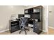 Spacious home office featuring a large desk, custom built-in shelving, and stylish decor at 4619 Villa Chase Ne Dr, Marietta, GA 30068