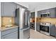 Well-equipped kitchen with stainless steel appliances, gray cabinetry, and a spacious layout at 4619 Villa Chase Ne Dr, Marietta, GA 30068