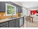 Well-lit kitchen with stainless steel appliances, granite counters and views of the outdoors from over the sink at 4619 Villa Chase Ne Dr, Marietta, GA 30068