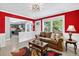 Bright living room with an open concept, a cozy sofa, and a view into the kitchen at 4619 Villa Chase Ne Dr, Marietta, GA 30068