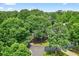 Scenic street view featuring mature trees and well-maintained landscaping at 4619 Villa Chase Ne Dr, Marietta, GA 30068