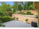 View from the back deck highlighting the brick driveway and landscaped surroundings at 570 Matterhorn Way, Alpharetta, GA 30022