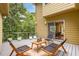 Relaxing back deck featuring outdoor seating, mature trees and convenient access to the house at 570 Matterhorn Way, Alpharetta, GA 30022