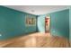Cozy bedroom with natural light, a window view, and wood-look flooring at 570 Matterhorn Way, Alpharetta, GA 30022