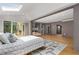 Stylish bedroom with skylights and an open floor plan to the outdoor deck at 570 Matterhorn Way, Alpharetta, GA 30022