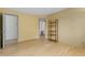 Spacious bedroom with wood floors, neutral walls, and a modern shelving unit at 570 Matterhorn Way, Alpharetta, GA 30022