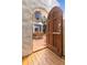 Wooden gate opens to a sunny courtyard with outdoor dining area, accessible from the home's interior at 570 Matterhorn Way, Alpharetta, GA 30022