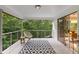 Covered deck with outdoor seating, perfect for relaxing and enjoying the nature view at 570 Matterhorn Way, Alpharetta, GA 30022