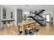 Modern dining room with hardwood floors, stone wall, and bright natural light at 570 Matterhorn Way, Alpharetta, GA 30022