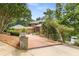 Long driveway surrounded by lush greenery leads to this beautiful home at 570 Matterhorn Way, Alpharetta, GA 30022