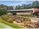 Beautiful landscaping surrounds the exterior of a modern building with many windows and a stone facade at 570 Matterhorn Way, Alpharetta, GA 30022