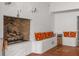 Rustic brick fireplace surrounded by cozy seating area and terracotta floors at 570 Matterhorn Way, Alpharetta, GA 30022