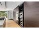 Modern kitchen with dark cabinets, built-in stainless steel appliances, and pullout storage at 570 Matterhorn Way, Alpharetta, GA 30022