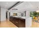 Spacious kitchen with large island, dark wood cabinetry, and a gas range cooktop at 570 Matterhorn Way, Alpharetta, GA 30022