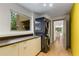 Contemporary laundry room with front loading washer and dryer plus abundant counter space at 570 Matterhorn Way, Alpharetta, GA 30022