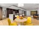 Open concept living area with kitchen island, dining space, and cozy living area with large glass doors at 570 Matterhorn Way, Alpharetta, GA 30022