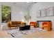 Stylish living room featuring sleek furniture, contemporary art, and plenty of natural light at 570 Matterhorn Way, Alpharetta, GA 30022